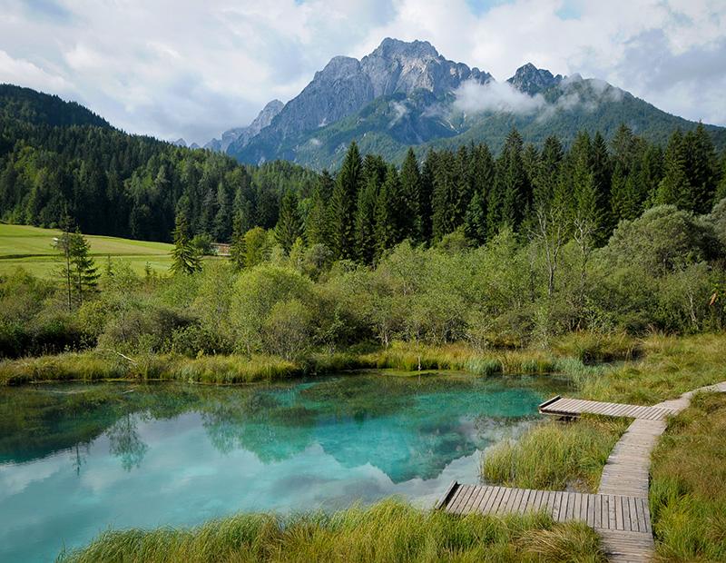 Zelenci Springs near Kranjska Gora, Slovenia, emerald green waters and wooden paths, highlight of walking and cycling holidays.