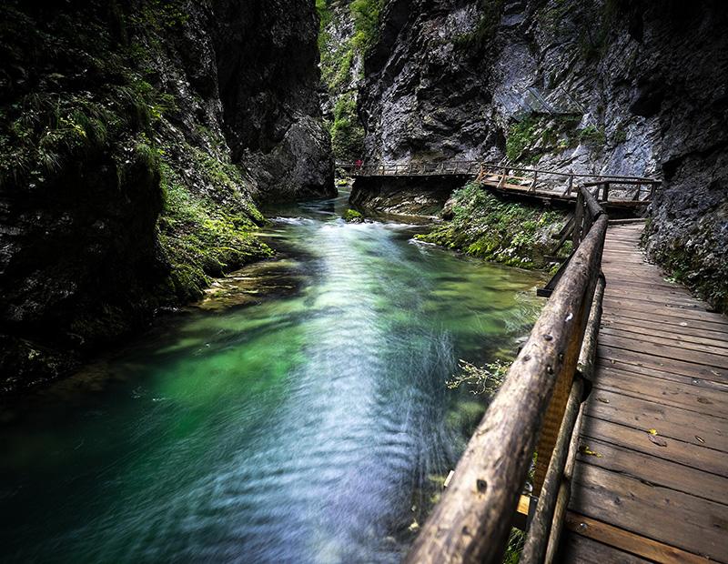 Wooden walkway along turquoise river in Vintgar Gorge, Bled, Slovenia